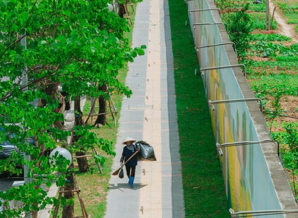 Street Cleaner Walking on Sidewalk