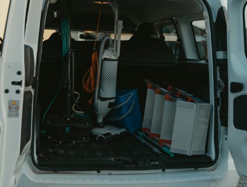 Man in Blue Denim Jeans in White Car
